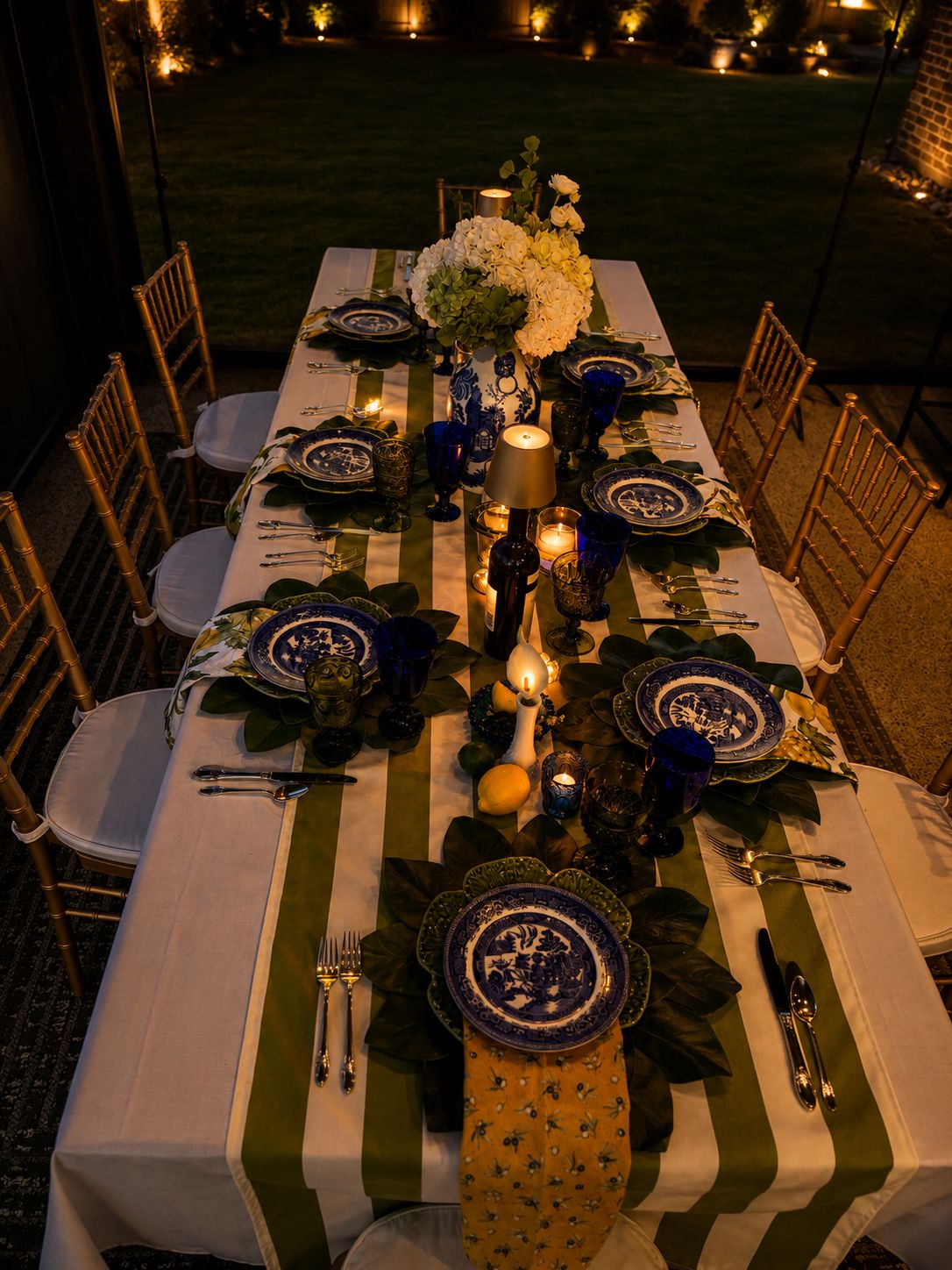 Candles down a long evening table