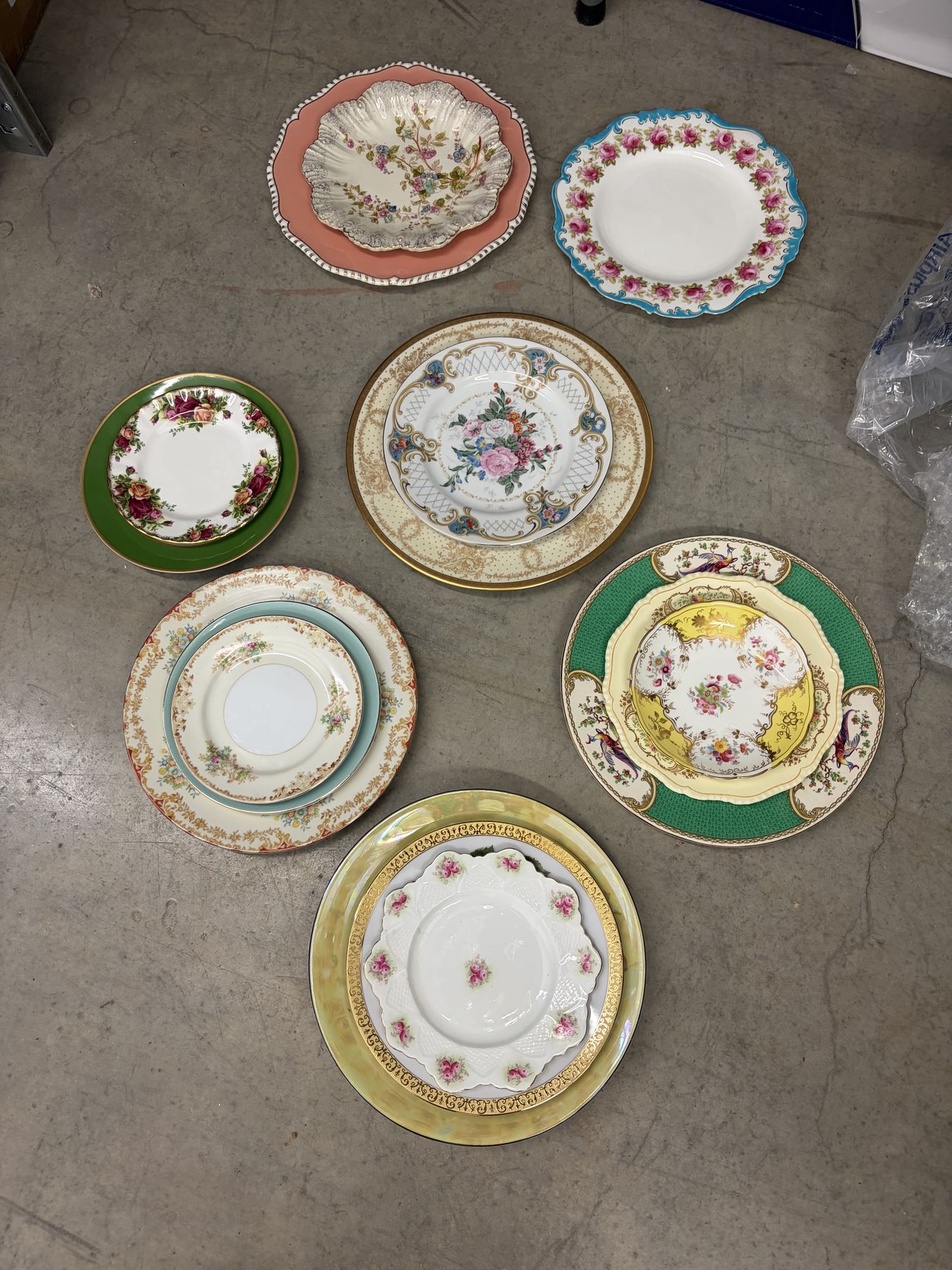 Vintage plates from the collection laid out on the floor